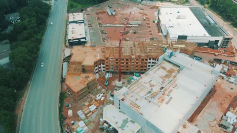 Drone-footage-of-an-active-construction-site-near-oncoming-traffic