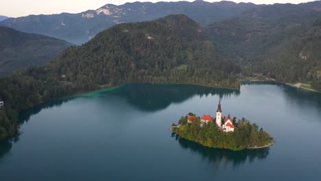 Beautiful-landscape-view-of-Lake-Bled,-Slovenia---aerial-view-of-Pilgrimage-Church-of-the-Assumption-of-Maria-above-Lake-Bled