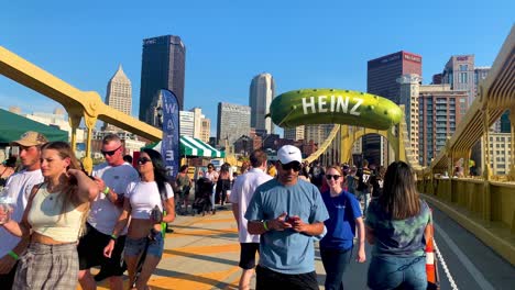 People-gathered-on-Andy-Warhol-Bridge-during-the-Picklesburgh-Food-festival-in-Pittsburgh,-Pennsylvania