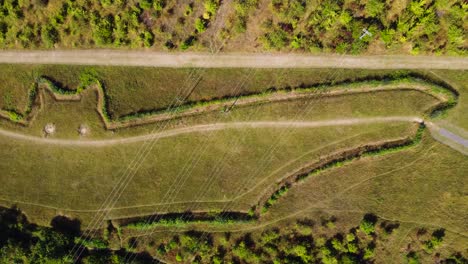Aerial:-Bat-field-at-Natterer's-Wood,-Suffolk---drone-tracking-shot