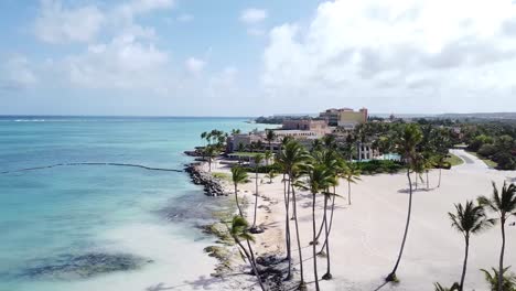 Top-view-of-punta-cana-beach-at-the-shore-of-the-blue-sea