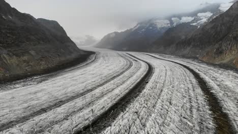 Aerial-flyover-over-the-longest-glacier-in-the-Alps---the-Aletsch-glacier-in-Valais,-Switzerland---with-motion-towards-Jungfrau