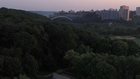 aerial-rise-over-inwood-park-looking-towards-the-Henry-Hudson-Bridge-in-Upper-Manhattan-New-York-City