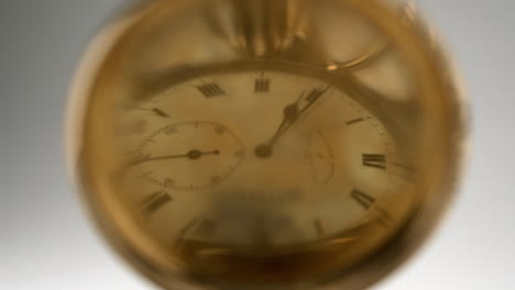 Antique-pocket-watch-time-reflection-in-gold