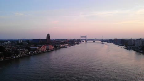 Aerial-Over-Oude-Maas-Against-Pink-Sunset-Skies-In-Dordrecht