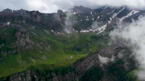 Wide-drone-shot-of-a-mountain-valley-near-Altenalp-Turm-in-Switzerland