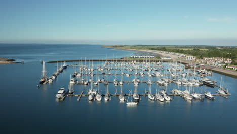 Aerial-View-Of-Yachts-And-Sailboats-Moored-On-Roompot-Marina-Haven-Near-Kamperland-In-Zeeland,-Netherlands
