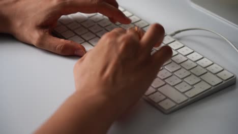 Close-up-of-female-hands-working-on-computer