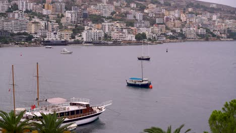 Calm-and-relaxing-scenery-with-boats-in-Saranda-harbor-in-Albania