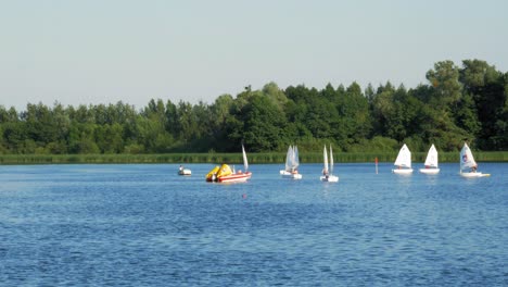 Sailing-Optimist-Dinghies-On-The-Water-Park-In-Kolbudy,-Gdansk,-Poland-In-Summer