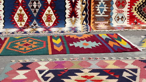 Colorful-rugs-on-display-in-street-in-Yerevan,-Armenia