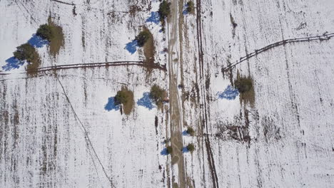 Aerial-top-view-of-snowy-footpath-in-the-mountain-in-winter