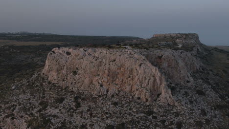 Aerial-footage-of-cliff-in-Ayia-Napa-in-Cyprus-on-sunset
