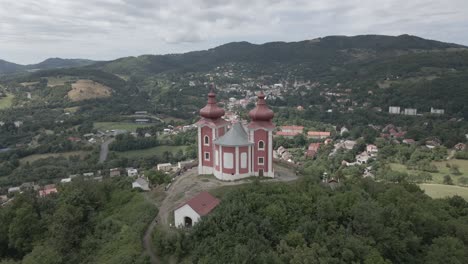 Chapel-with-view-on-the-small-city-in-the-middle-of-mountains