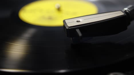 Record-player-needle-lowering-and-then-moving-across-the-record