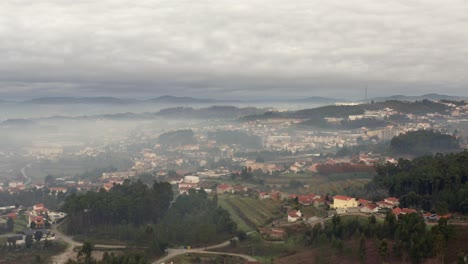 Mist-And-Clouds-Over-Houses-And-Fields-On-Town-Near-Oporto,-Portugal-At-Early-Morning