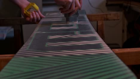 Home-made-waxing-of-a-green-snowboard