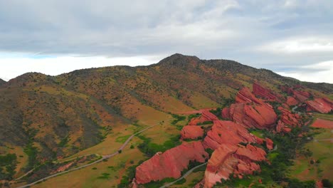 Aerial-shot-rising-up-above-Red-Rocks-Park-and-Amphitheatre