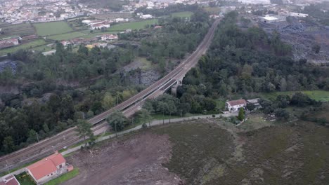 Railroad-Bridge-Near-Countryside-And-Town-Of-Porto,-Portugal-At-Daytime