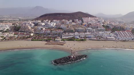 Aerial-view-of-Los-Cristianos-comunity-in-Tenerife-island-on-the-Canary-islands,-Spain-on-a-sunny-day