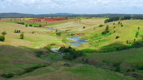 Aerial-View-Of-Green-Farmland-In-Atherton-Tablelands-Region,-Queensland,-Australia---drone-shot