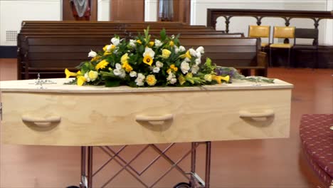 closeup-shot-of-a-funeral-casket-or-coffin-in-a-hearse-or-chapel-or-burial-at-cemetery
