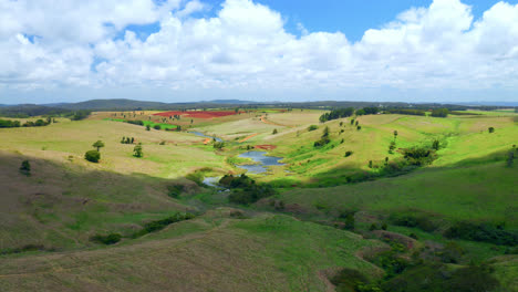 Nature-Landscape-With-Green-Fields-And-Creeks-In-Atherton-Tablelands,-Queensland,-Australia---aerial-drone-shot