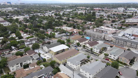 Aerial-tilt-up-shot-descending-over-Glendale-district-on-cloudy-day