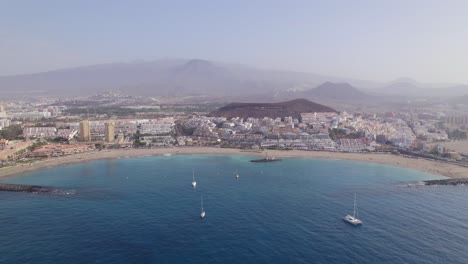 Aerial-view-of-ships-sailing-alone-the-cost-of-Tenerife,-Canary-islands,-Spain