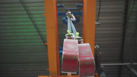 Industrial-heavy-lifting-machinery,-crane-steel-chain-lifting-hooks