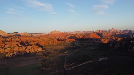 Beautiful-aerial-landscape-view-of-red-rocks-in-a-desert-at-sunset,-Snow-Canyon-State-Park,-Utah