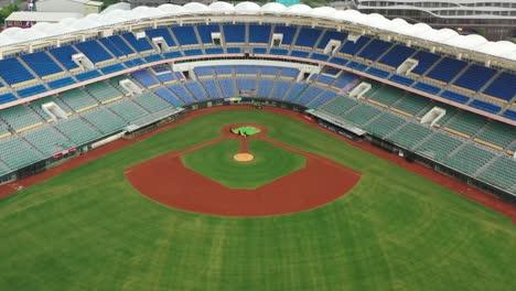 Aerial-ascending-tilt-view-at-the-iconic-baseball-league-stadium-at-downtown-douliu-city,-yunlin-county-Taiwan