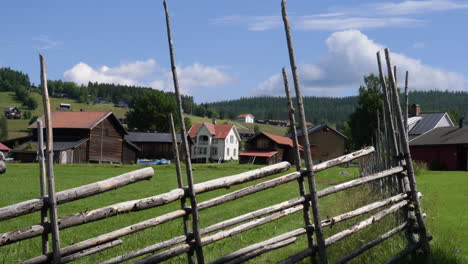 Gimbal-pan-left-shot-of-traditional-village-in-Jamtland-on-sunny-day,-Sweden