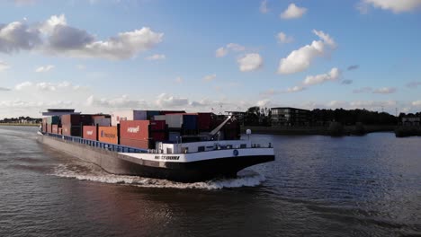 Aerial-View-Of-Missouri-Inland-Container-Vessel-Navigating-River-Noord