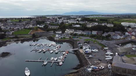 Aerial-view-of-Ardglass-harbour-and-town-on-a-cloudy-day,-County-Down,-Northern-Ireland