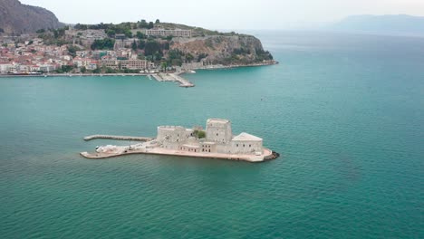 Greek-scenic-view-of-a-prision-tower-in-the-ocean,-Bourtzi