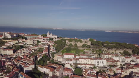 Drone-orbiting-around-the-castle-overlooking-Lisbon-in-Portugal
