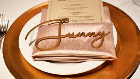 Close-Up-of-Dinner-Plate-and-Tableware-at-Wedding,-Decoration-Spelling-Sunny