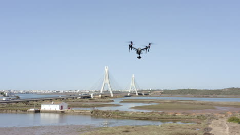 footage-of-drone-dji-inspire-during-a-test-flight-against-the-background-of-the-Portimao-Railway-Bridge,-in-the-Faro-District,-Portugal-on-November-10,-2021