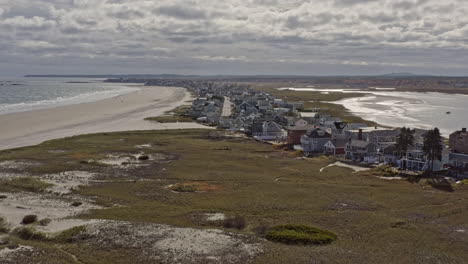 Wells-Maine-Aerial-v3-cinematic-dolly-in-shot,-drone-fly-along-atlantic-avenue-capturing-oceanfront-residential-houses-and-cottages-towards-horizon-during-daytime---October-2020