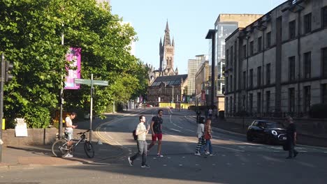 A-wide-slow-motion-of-pedestrians-crossing-Byres-Road