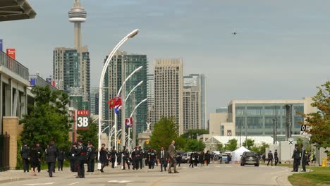 Military-soldiers-walking-after-a-funeral-ceremony-in-front-of-cantonment-area-at-Toronto,-Canada