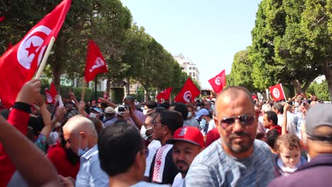 Demonstrators-Carrying-Tunisian-Flag-In-The-City-Of-Tunis-During-Protest-Against-President-Kais-Saied's-Seizure-Of-Governing-Powers-In-Tunisia
