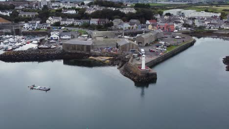 Aerial-view-of-Ardglass-harbour-and-town-on-a-cloudy-day,-County-Down,-Northern-Ireland