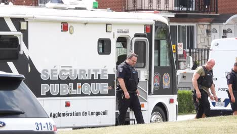 Public-Security-Officers-And-Service-Van-At-The-Scene-Of-A-Shooting-Incident-In-Longueuil,-Canada
