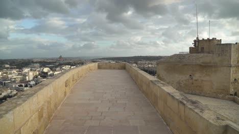 Walking-on-Defensive-Cittadella-Fortress-Wall-on-Cloudy-Stormy-Windy-Day-in-Gozo-Island