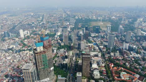 Aerial-forward-over-Jakarta-city,-Indonesia