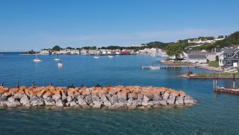 Drone-Panning-View-of-Large-Rock-Seawall-Barrier-near-Cape-Cod-Public-Marina