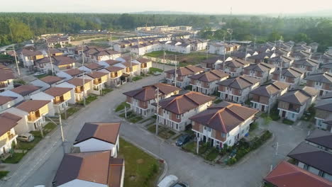 Aerial-Shot-Of-A-Newly-Built-Village-In-Asia-During-Sunset