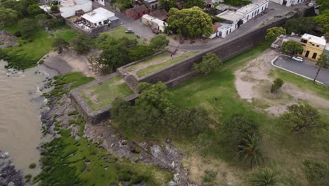 Aerial-ascend-shot-showing-Fort-of-Colonia-del-Sacramento-in-historical-Town,Uruguay